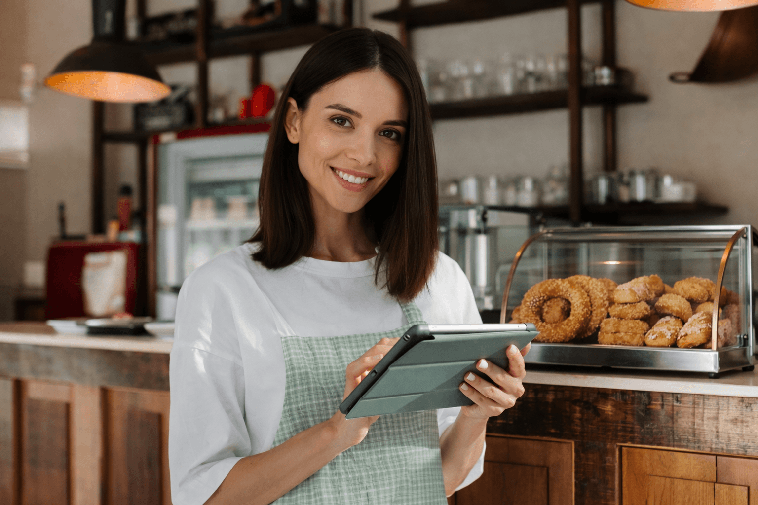 Cafe owner with tablet